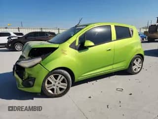 2014 Chevrolet Spark LS with VIN KL8CB6S94EC565436, listed as a Copart auction lot 86057295 with 106,927 mi miles and Salvage title. Bid and sale history available at DreamBid. Image 1.