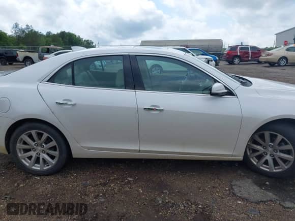 2015 Chevrolet Malibu LTZ with VIN 1G11F5SL0FF220857, listed as a IAAI auction lot 42107647 with 143,330 mi miles and . Bid and sale history available at DreamBid. Image 13.
