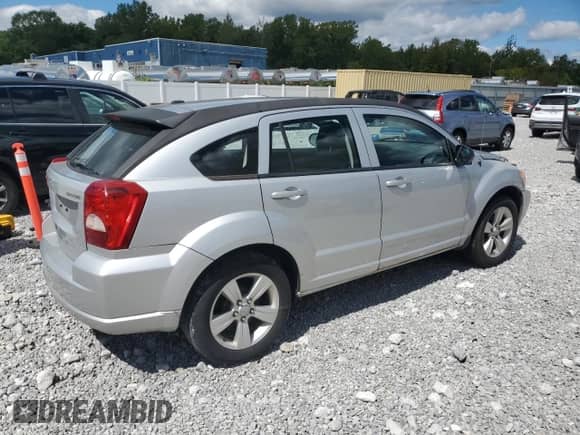 2011 Dodge Caliber Mainstreet with VIN 1B3CB3HA1BD298643, listed as a Copart auction lot 70346555 with 157,144 mi miles and Salvage title. Bid and sale history available at DreamBid. Image 3.