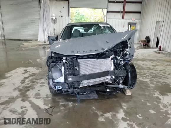2024 Hyundai Santa Cruz SEL с VIN 5NTJBDAEXRH100494, выставлен на аукционе Copart как лот 81604825 с пробегом Не указан миль и Списание • Salvage title. История ставок и продаж доступна на DreamBid. Изображение 14.