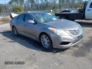 2013 Hyundai Azera with VIN KMHFH4JG7DA260834, listed as a IAAI auction lot 41524437 with 152,992 mi miles and . Bid and sale history available at DreamBid. Image 1.