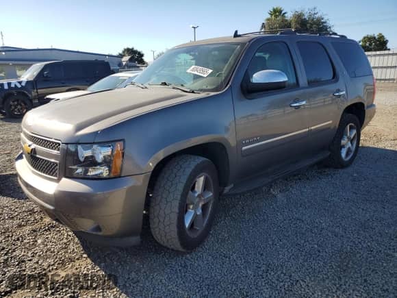 2013 Chevrolet Tahoe LTZ с VIN 1GNSCCE01DR365631, выставлен на аукционе Copart как лот 80849565 с пробегом 260 352 миль миль и Чистый • Clean title. История ставок и продаж доступна на DreamBid. Изображение 1.
