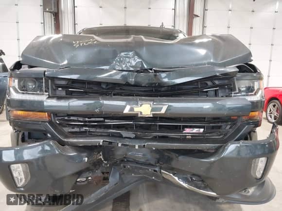2018 Chevrolet Silverado 1500 LT with VIN 3GCUKREC9JG218440, listed as a IAAI auction lot 42917532 with 71,892 mi miles and . Bid and sale history available at DreamBid. Image 6.