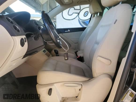 2014 Volkswagen Tiguan S with VIN WVGAV3AX2EW557334, listed as a Copart auction lot 87487345 with 118,599 mi miles and Clean title. Bid and sale history available at DreamBid. Image 7.