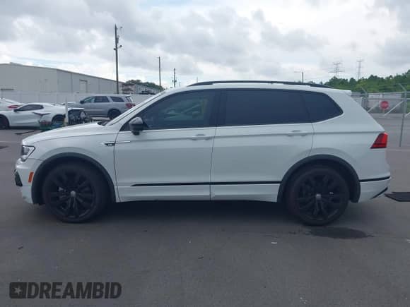 2021 Volkswagen Tiguan SE with VIN 3VV3B7AX5MM099222, listed as a IAAI auction lot 43180751 with 64,558 mi miles and . Bid and sale history available at DreamBid. Image 14.