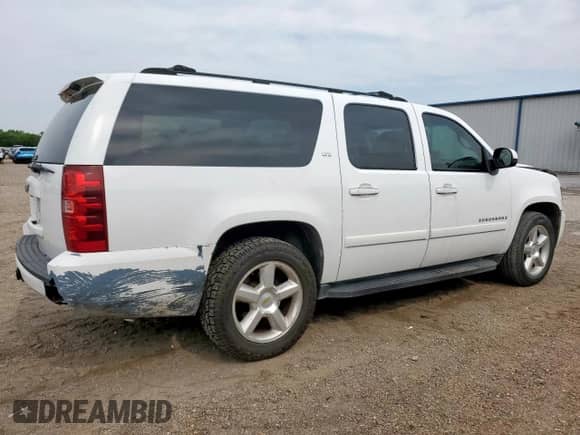 2007 Chevrolet Suburban LTZ с VIN 3GNFC16J07G153658, выставлен на аукционе Copart как лот 58020255 с пробегом 319 762 миль миль и Списание • Salvage title. История ставок и продаж доступна на DreamBid. Изображение 3.