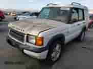 2000 Land Rover Discovery Cloth with VIN SALTY1543YA273374, listed as a Copart auction lot 86026964 with 115,114 mi miles and Clean title. Bid and sale history available at DreamBid. Image 1.