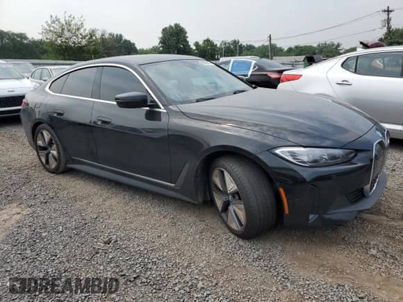 2023 BMW i4 eDrive35 with VIN WBY43AW0XPFP92914, listed as a Copart auction lot 66748865 with 32,088 mi miles and Salvage title. Bid and sale history available at DreamBid. Image 4.