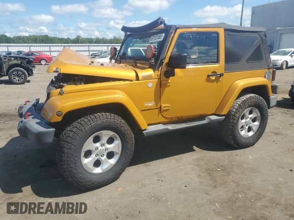 2014 Jeep Wrangler Sahara с VIN 1C4AJWBG0EL325946, выставлен на аукционе Copart как лот 68162465 с пробегом 139 980 миль миль и Списание • Salvage title. История ставок и продаж доступна на DreamBid. Изображение 1.