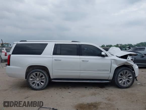 2018 Chevrolet Suburban Premier z VIN 1GNSKJKC2JR378793, wystawiony jako IAAI lot #42327679 z przebiegiem 151 091 mil mil oraz . Historia ofert i sprzedaży dostępna na DreamBid. Obrazek 13.