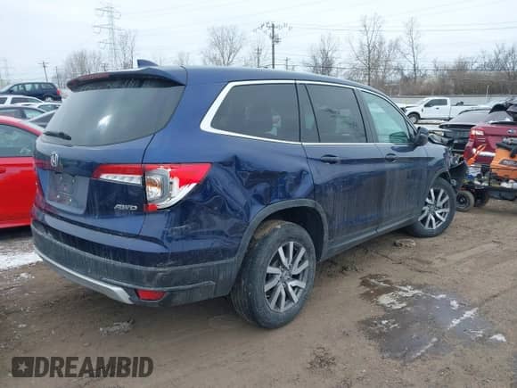 2022 Honda Pilot EX-L with VIN 5FNYF6H53NB010082, listed as a IAAI auction lot 41605798 with 52,733 mi miles and . Bid and sale history available at DreamBid. Image 4.