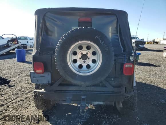 2003 Jeep Wrangler X z VIN 1J4FA39S73P346680, wystawiony jako Copart lot #86513335 z przebiegiem Nie podano mil oraz Szkoda całkowita • Salvage title. Historia ofert i sprzedaży dostępna na DreamBid. Obrazek 6.