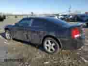 2010 Dodge Charger 3.5L with VIN 2B3CK2CV5AH318074, listed as a Copart auction lot 86012634 with 122,498 mi miles and Salvage title. Bid and sale history available at DreamBid. Image 2.