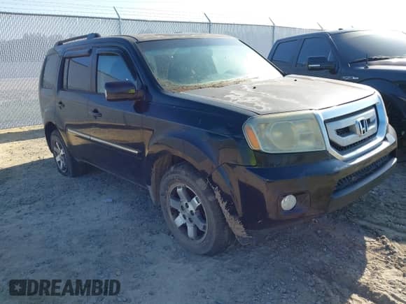 2010 Honda Pilot Touring with VIN 5FNYF3H97AB008623, listed as a IAAI auction lot 42797309 with 312,005 mi miles and . Bid and sale history available at DreamBid. Image 1.