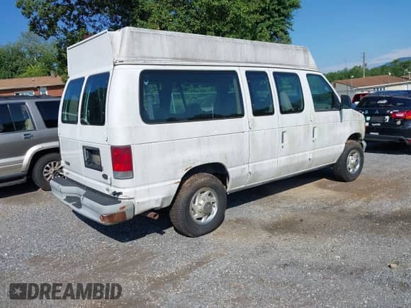 2002 Ford Econoline Cargo with VIN 1FTNE242X2HA90857, listed as a IAAI auction lot 42716391 with 103,796 mi miles and . Bid and sale history available at DreamBid. Image 4.