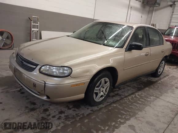 2005 Chevrolet Malibu Classic z VIN 1G1ND52F25M126197, wystawiony jako IAAI lot #41635127 z przebiegiem 218 168 mil mil oraz . Historia ofert i sprzedaży dostępna na DreamBid. Obrazek 2.