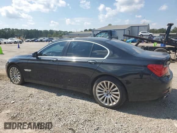 2012 BMW 7 Series 750i with VIN WBAKA8C59CDY99916, listed as a Copart auction lot 82019145 with 104,713 mi miles and Clean title. Bid and sale history available at DreamBid. Image 2.