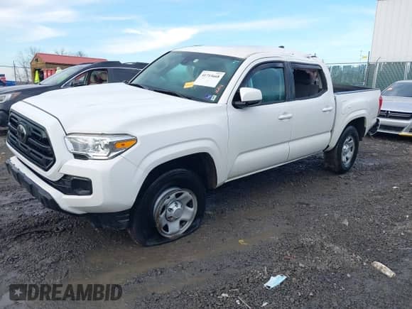 2019 Toyota Tacoma SR with VIN 3TMCZ5ANXKM257869, listed as a IAAI auction lot 41715668 with 99,452 mi miles and . Bid and sale history available at DreamBid. Image 2.