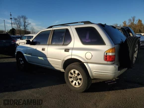1998 Honda Passport LX with VIN 4S6CM58W0W4404170, listed as a Copart auction lot 83777484 with 181,140 mi miles and Salvage title. Bid and sale history available at DreamBid. Image 2.