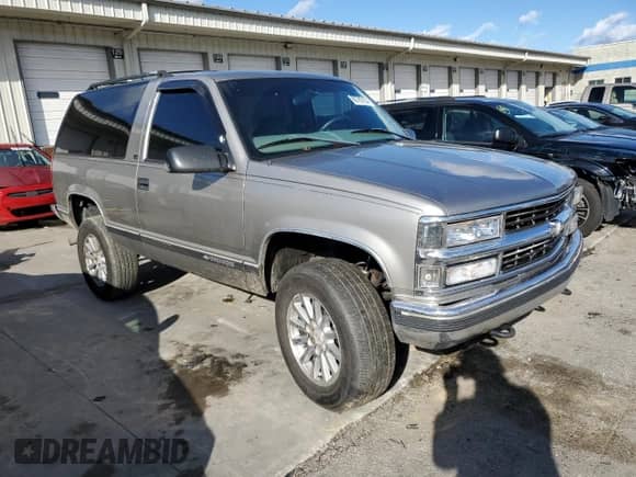 1999 Chevrolet Tahoe with VIN 3GNEK18R9XG152347, listed as a Copart auction lot 80785154 with 301,018 mi miles and Salvage title. Bid and sale history available at DreamBid. Image 4.