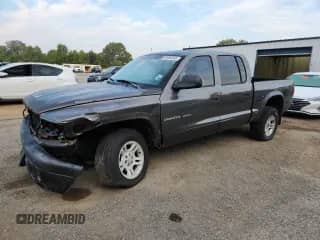2002 Dodge Dakota с VIN 1B7HG38Z82S599207, выставлен на аукционе Copart как лот 80690245 с пробегом 185 829 миль миль и Списание • Salvage title. История ставок и продаж доступна на DreamBid. Изображение 1.