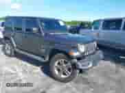 2021 Jeep Wrangler Unlimited Sahara z VIN 1C4HJXEN3MW525716, wystawiony jako IAAI lot #42974390 z przebiegiem 87 931 mil mil oraz . Historia ofert i sprzedaży dostępna na DreamBid. Obrazek 1.