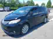 2013 Toyota Sienna XLE with VIN 5TDDK3DC0DS051969, listed as a IAAI auction lot 42344494 with 166,890 mi miles and . Bid and sale history available at DreamBid. Image 2.