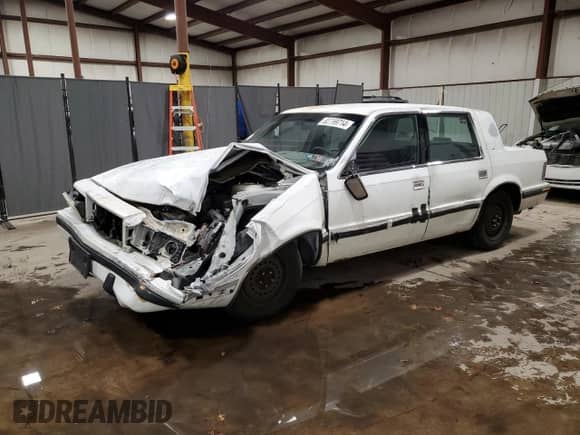 1992 Dodge Dynasty LE with VIN 1B3XC56RXND822802, listed as a Copart auction lot 82799714 with 137,131 mi miles and Salvage title. Bid and sale history available at DreamBid. Image 1.