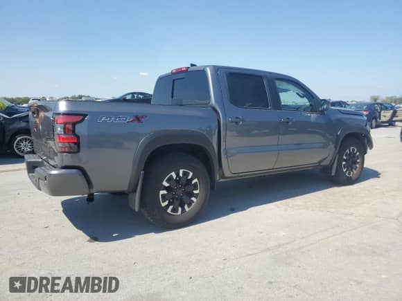 2024 Nissan Frontier Pro-X with VIN 1N6ED1EJ7RN658493, listed as a Copart auction lot 81479765 with 20,584 mi miles and Salvage title. Bid and sale history available at DreamBid. Image 3.