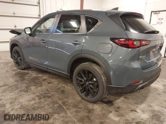 2023 Mazda CX-5 S Carbon Edition z VIN JM3KFBCM1P0238345, wystawiony jako IAAI lot #42799769 z przebiegiem 53 614 mil mil oraz . Historia ofert i sprzedaży dostępna na DreamBid. Obrazek 3.