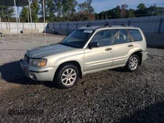 2005 Subaru Forester XS with VIN JF1SG65615H706042, listed as a Copart auction lot 71028705 with 141,786 mi miles and Salvage title. Bid and sale history available at DreamBid. Image 1.