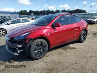 2024 Tesla Model Y Long Range with VIN 7SAYGDEEXRA280762, listed as a Copart auction lot 70487715 with 7,864 mi miles and Salvage title. Bid and sale history available at DreamBid. Image 1.