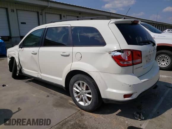 2014 Dodge Journey SXT with VIN 3C4PDCBB6ET134685, listed as a Copart auction lot 58577595 with 213,926 mi miles and Salvage title. Bid and sale history available at DreamBid. Image 2.