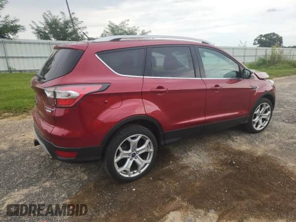 2017 Ford Escape Titanium с VIN 1FMCU0J95HUA77073, выставлен на аукционе Copart как лот 70429605 с пробегом 55 737 миль миль и На запчасти • Non repairable. История ставок и продаж доступна на DreamBid. Изображение 3.