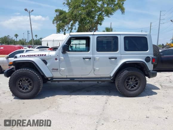 2023 Jeep Wrangler Rubicon with VIN 1C4JJXFG0PW522651, listed as a IAAI auction lot 42112210 with 7,744 mi miles and . Bid and sale history available at DreamBid. Image 15.