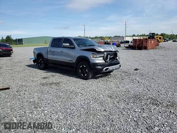 2020 Ram 1500 Rebel z VIN 1C6SRFLT7LN199084, wystawiony jako Copart lot #64990655 z przebiegiem 143 021 mil mil oraz Nie do naprawy • Non repairable. Historia ofert i sprzedaży dostępna na DreamBid. Obrazek 14.