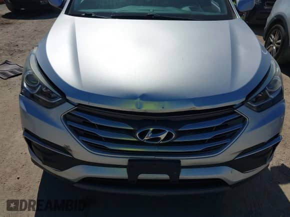 2018 Hyundai Santa Fe 2.4L with VIN 5XYZT3LB5JG563330, listed as a IAAI auction lot 43397944 with 124,663 mi miles and . Bid and sale history available at DreamBid. Image 6.