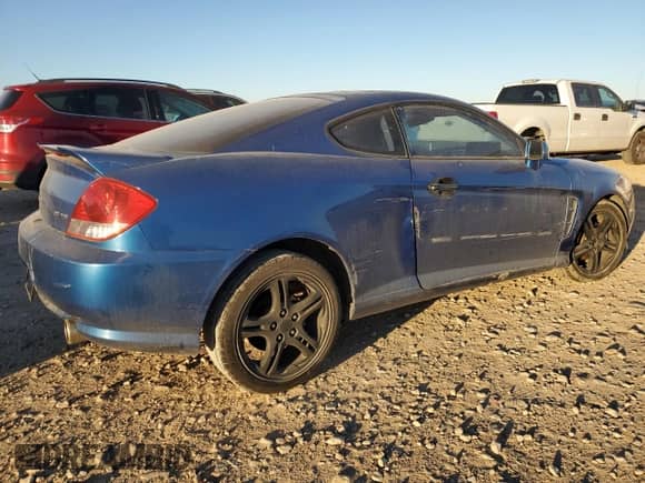 2005 Hyundai Tiburon GT with VIN KMHHN65F35U186438, listed as a Copart auction lot 41879955 with 152,574 mi miles and Salvage title. Bid and sale history available at DreamBid. Image 3.