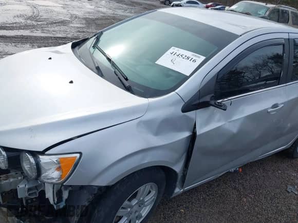 2015 Chevrolet Sonic LT with VIN 1G1JD5SH5F4217403, listed as a IAAI auction lot 41452816 with 105,447 mi miles and . Bid and sale history available at DreamBid. Image 12.