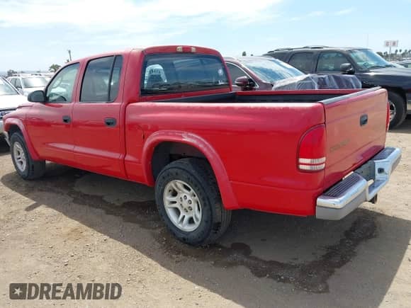 2003 Dodge Dakota SLT z VIN 1D7HL48N23S291004, wystawiony jako IAAI lot #43037545 z przebiegiem 117 931 mil mil oraz . Historia ofert i sprzedaży dostępna na DreamBid. Obrazek 3.