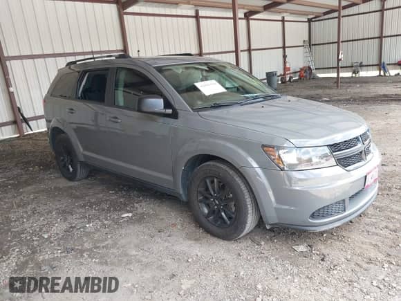 2020 Dodge Journey SE Value with VIN 3C4PDCABXLT259669, listed as a IAAI auction lot 42995598 with 98,957 mi miles and . Bid and sale history available at DreamBid. Image 1.