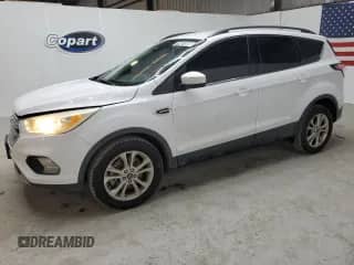 2017 Ford Escape SE z VIN 1FMCU9G90HUE38138, wystawiony jako Copart lot #71461865 z przebiegiem 91 468 mil mil oraz Czysty tytuł • Clean title. Historia ofert i sprzedaży dostępna na DreamBid. Obrazek 1.