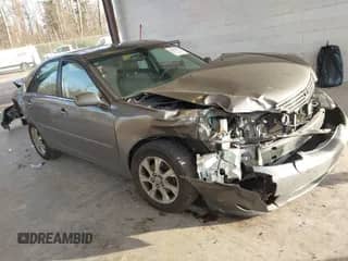 2005 Toyota Camry LE with VIN 4T1BF30K35U592032, listed as a IAAI auction lot 41372771 with 222,846 mi miles and . Bid and sale history available at DreamBid. Image 1.