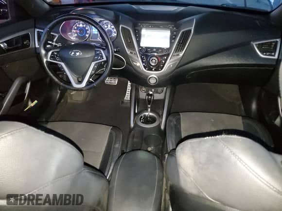 2016 Hyundai Veloster z VIN KMHTC6AD4GU302690, wystawiony jako Copart lot #83694004 z przebiegiem 150 846 mil mil oraz Szkoda całkowita • Salvage title. Historia ofert i sprzedaży dostępna na DreamBid. Obrazek 8.