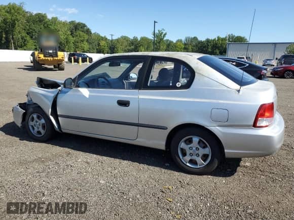2002 Hyundai Accent z VIN KMHCF35G72U217653, wystawiony jako Copart lot #70099915 z przebiegiem 168 308 mil mil oraz Szkoda całkowita • Salvage title. Historia ofert i sprzedaży dostępna na DreamBid. Obrazek 2.