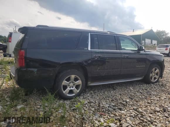 2015 Chevrolet Suburban LTZ с VIN 1GNSKKKC8FR199218, выставлен на аукционе Copart как лот 64147184 с пробегом 181 676 миль миль и Списание • Salvage title. История ставок и продаж доступна на DreamBid. Изображение 3.