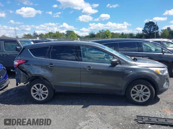 2017 Ford Escape SE z VIN 1FMCU9GD3HUB64504, wystawiony jako IAAI lot #43069107 z przebiegiem 133 830 mil mil oraz . Historia ofert i sprzedaży dostępna na DreamBid. Obrazek 13.