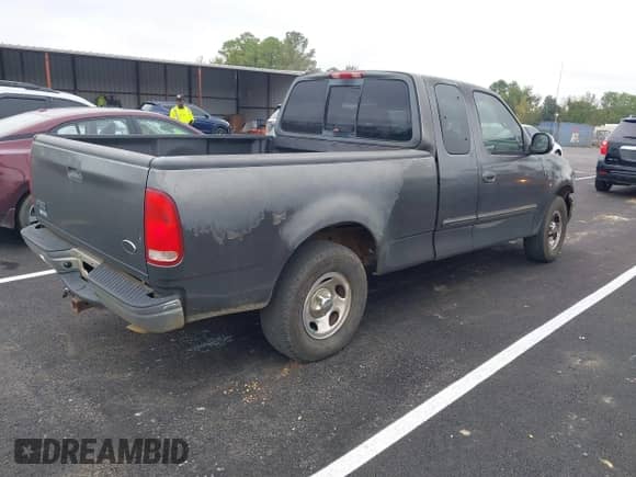 2002 Ford F-150 XL with VIN 2FTRX17L22CA34476, listed as a IAAI auction lot 43390303 with 237,458 mi miles and . Bid and sale history available at DreamBid. Image 4.