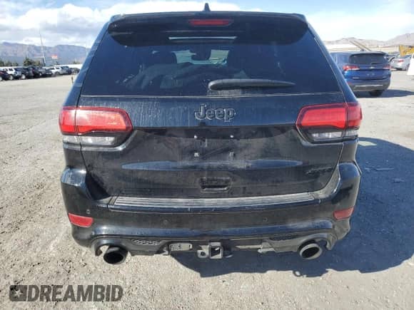 2020 Jeep Grand Cherokee SRT with VIN 1C4RJFDJ8LC194757, listed as a Copart auction lot 49316055 with 54,416 mi miles and Salvage title. Bid and sale history available at DreamBid. Image 6.