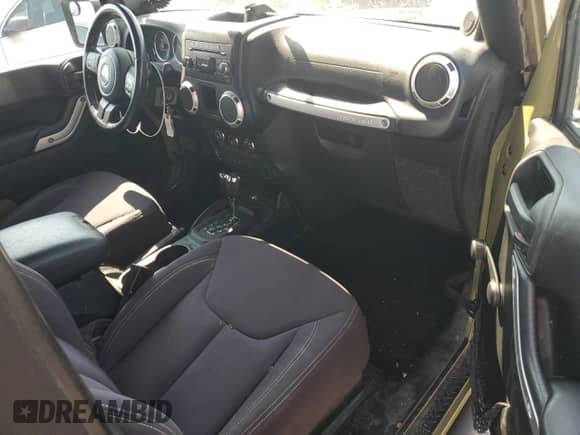 2013 Jeep Wrangler Rubicon with VIN 1C4HJWCG0DL566479, listed as a Copart auction lot 69092745 with 103,839 mi miles and Salvage title. Bid and sale history available at DreamBid. Image 8.